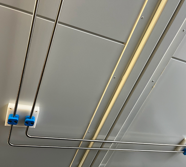 Installed stainless steel process piping inside the H<sub>2</sub>-in-the-Loop plant container.